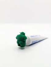 Load image into Gallery viewer, Shrek pooping toothpaste topper, product photo 3 of 8